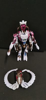 A Hasbro Transformers Beast Wars Transmetals 2 Deluxe Class Ramulus Action Figure. A 