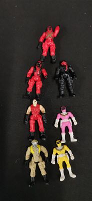 A Collection of Seven Power Rangers Miniature Plastic Action Figures and more. This collection 