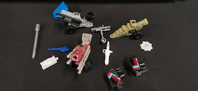 An Assortment of Vintage Action Figure Vehicle Parts and Accessories attributed to Hasbro G.I. 