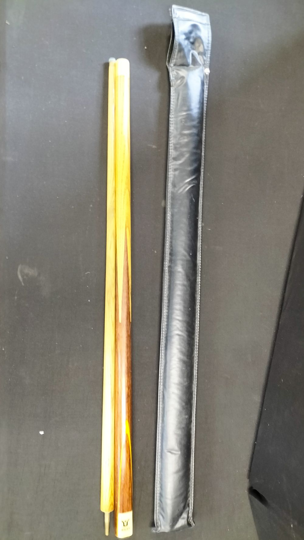 A Two-Piece Riley Snooker Cue with Protective Case. A two-piece snooker cue manufactured by 