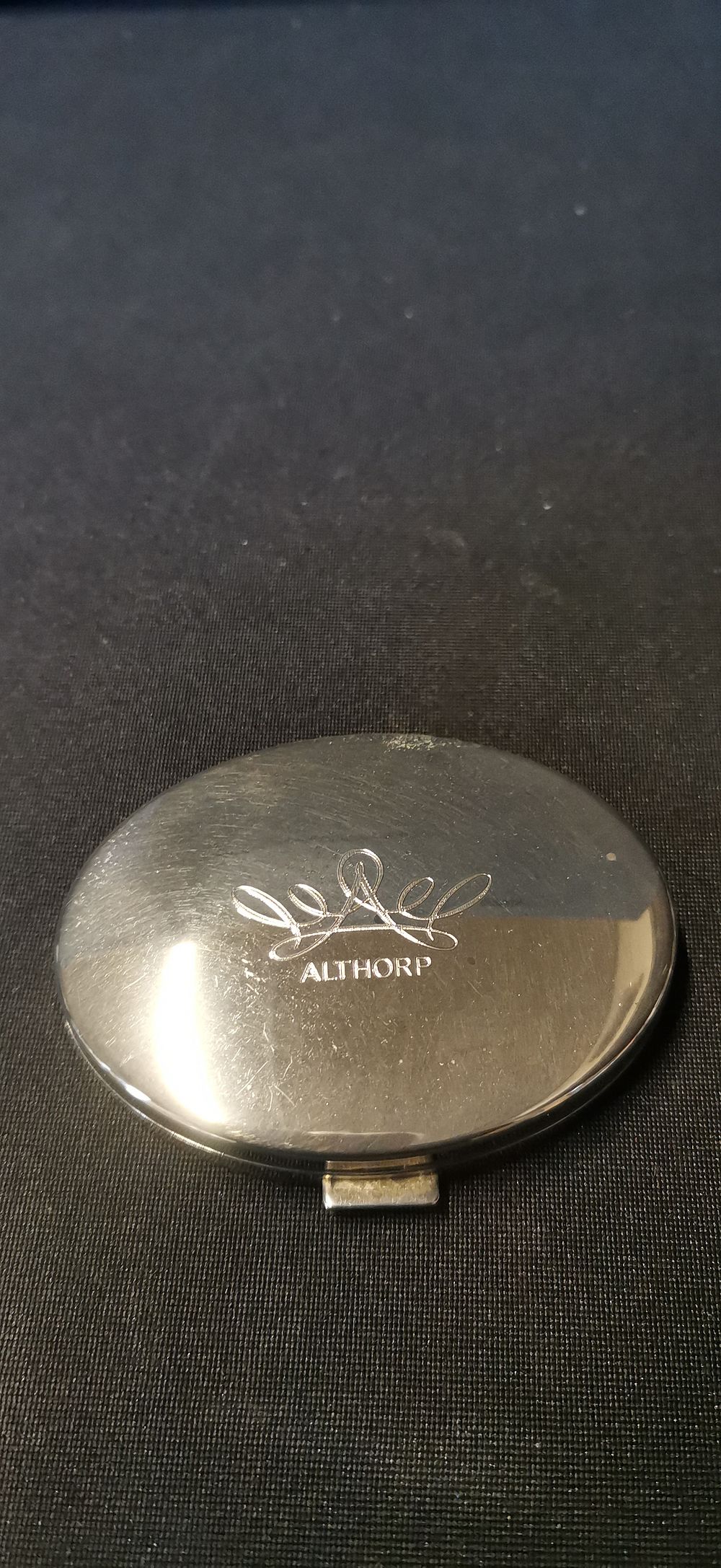 Lot 552: An Althorp House Branded Polished White Metal Double Compact Mirror