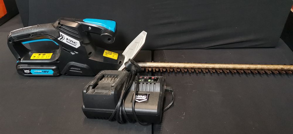 Lot 555: Mac Allister MHTP18LI Cordless Hedge Trimmer with 18V Battery and Charger. Tested for Power. COLLECTION ONLY