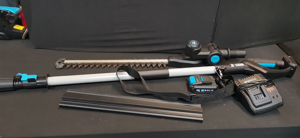 Lot 556: Mac Allister MPHT1845-Li 18V Cordless Pole Hedge Trimmer Kit. With Charger and Battery. COLLECTION ONLY