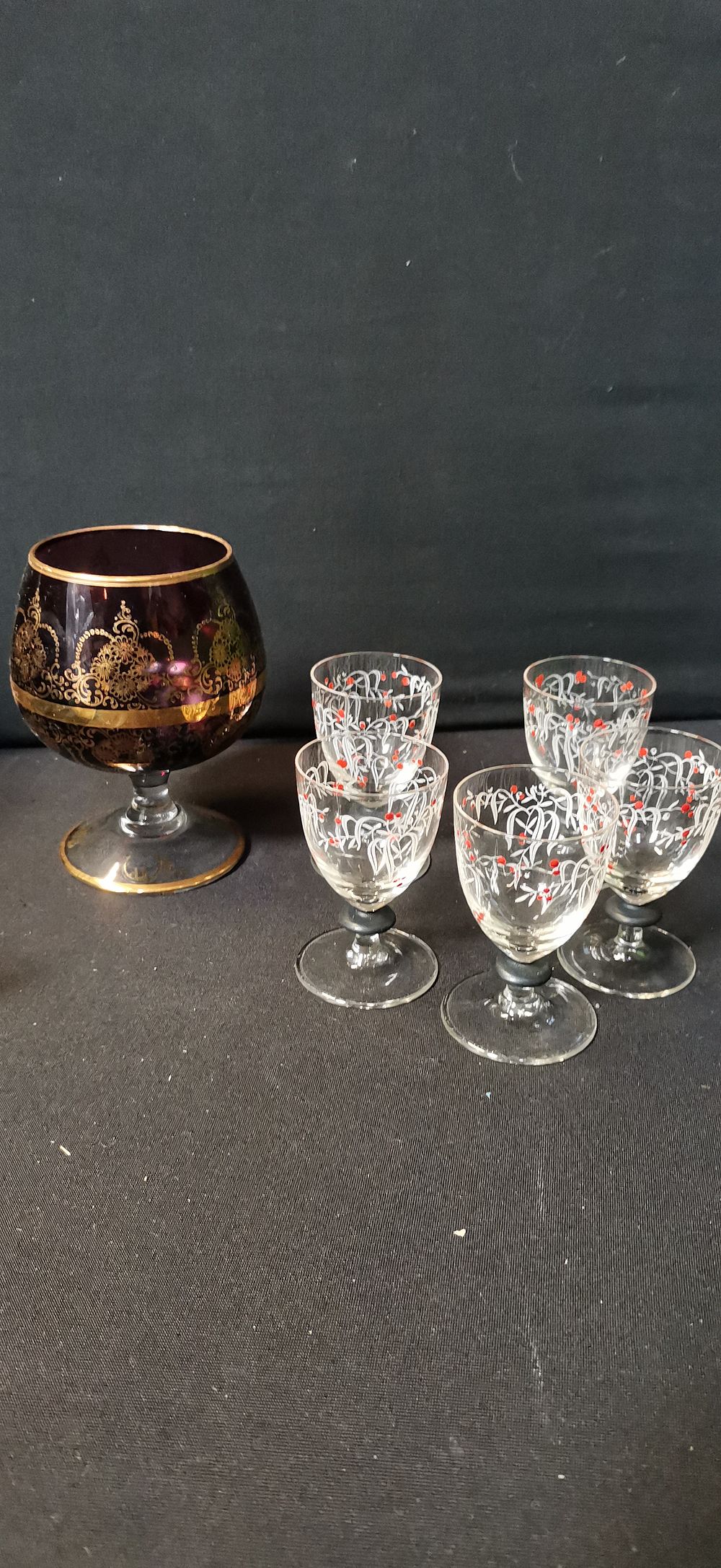 Lot 578: An Assortment of Vintage Glassware Including an Amethyst and Gilt Snifter and a Set of Five Liqueur Glasses