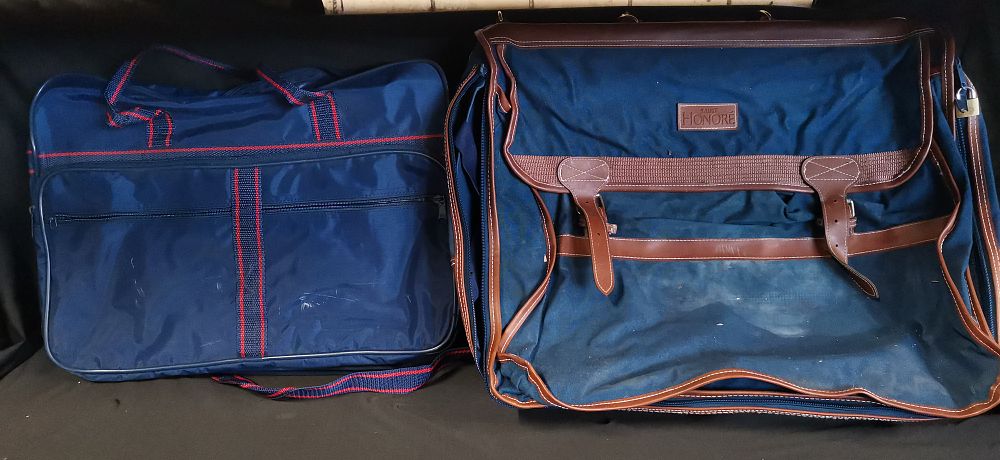 Lot 593: Two vintage navy blue travel bags including a Saint Honore example