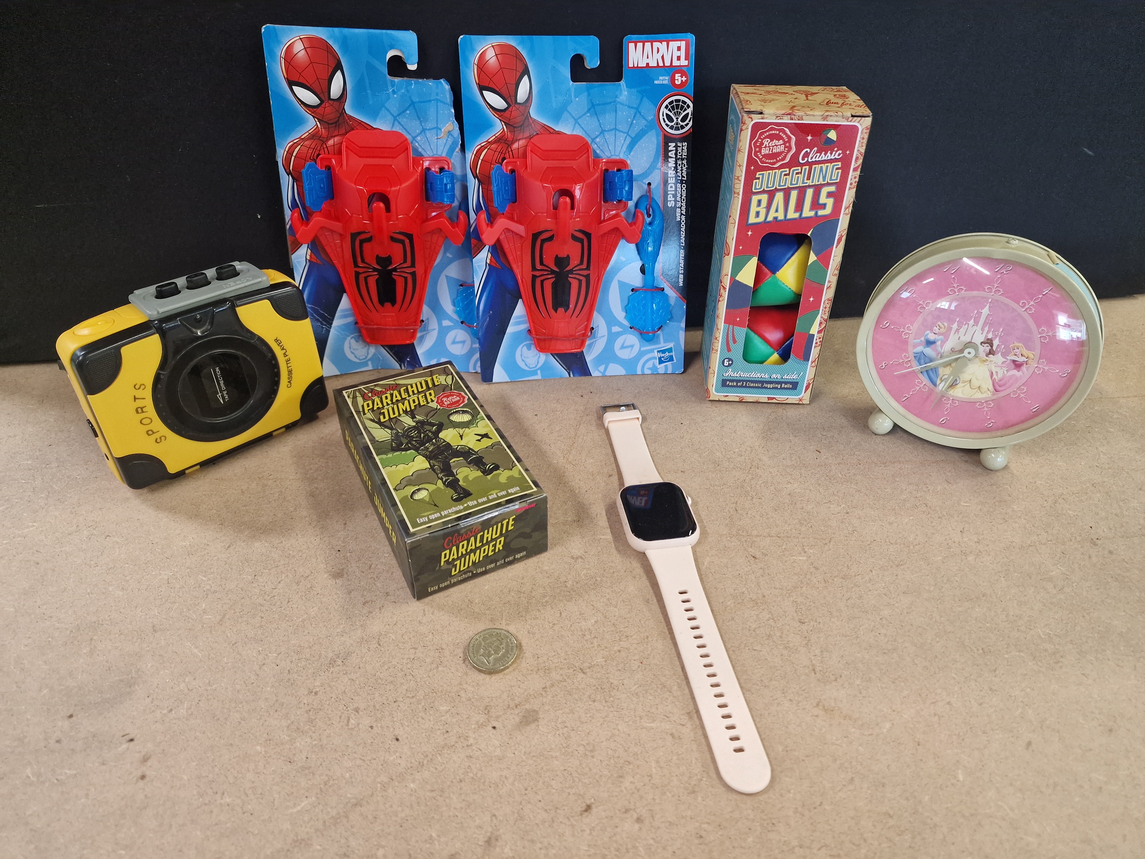 A Collection of Modern Toys, Portable Electronics, and a Disney Princess Alarm Clock