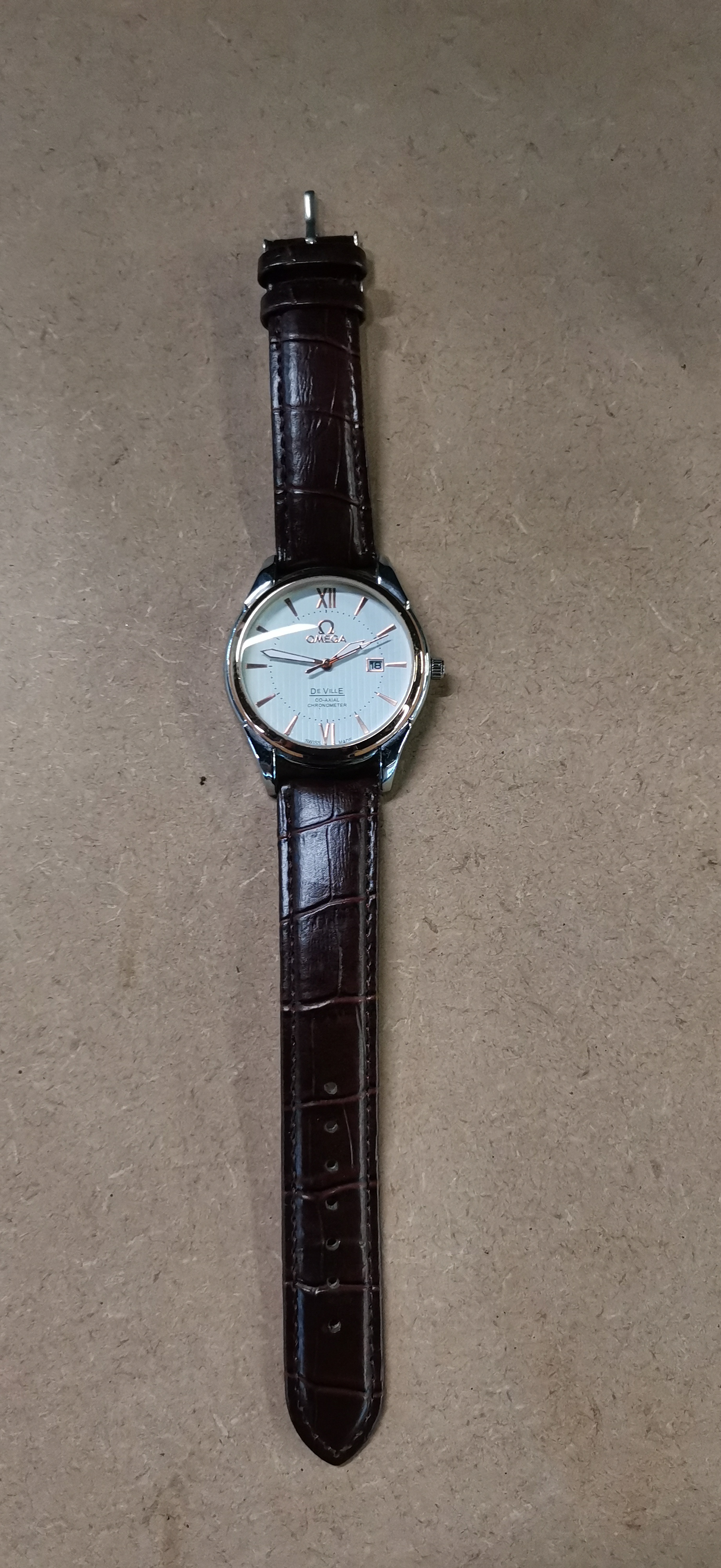 A gentleman's two-tone Fashion wrist watch bearing the name Omega De Ville