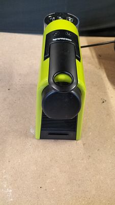 Magimix Nespresso Essenza Mini Coffee Machine in Lime Green. A lime green and black Magimix 