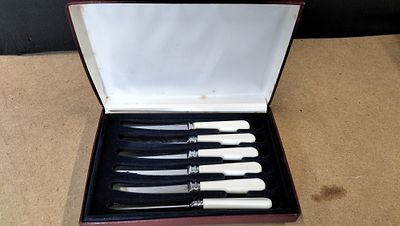 A Collection of Sheffield Stainless Steel Faux Bone Handle Knives. A collection of stainless 