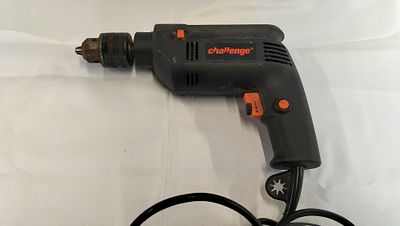 Challenge PDI13YE 500W Corded Electric Power Drill, Tested for Power. A black and orange 