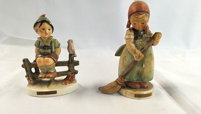 A Pair of Goebel M.I. Hummel Ceramic Figurines. A pair of hand-painted ceramic figurines titled 