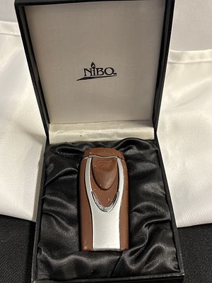 NIBO Windproof Jet Flame Torch Lighter in Original Presentation Box, Contemporary. This lot 