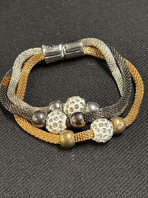A tri-colour mesh strand bracelet with crystal-set sliding beads. A contemporary costume 