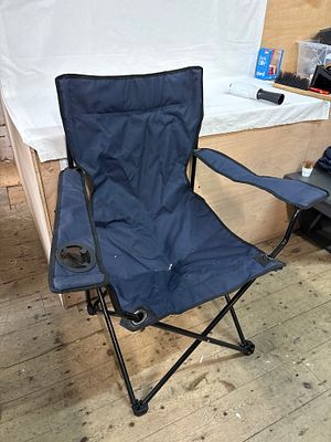 A Navy Blue Hammock-Style Folding Camping Chair with Carrying Bag, Early 21st Century. This 