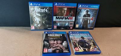 A Collection of Five PlayStation 4 Video Games Including Fallout 4 and Uncharted 4