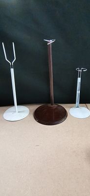 A Trio of Metal Doll and Teddy Bear Stands