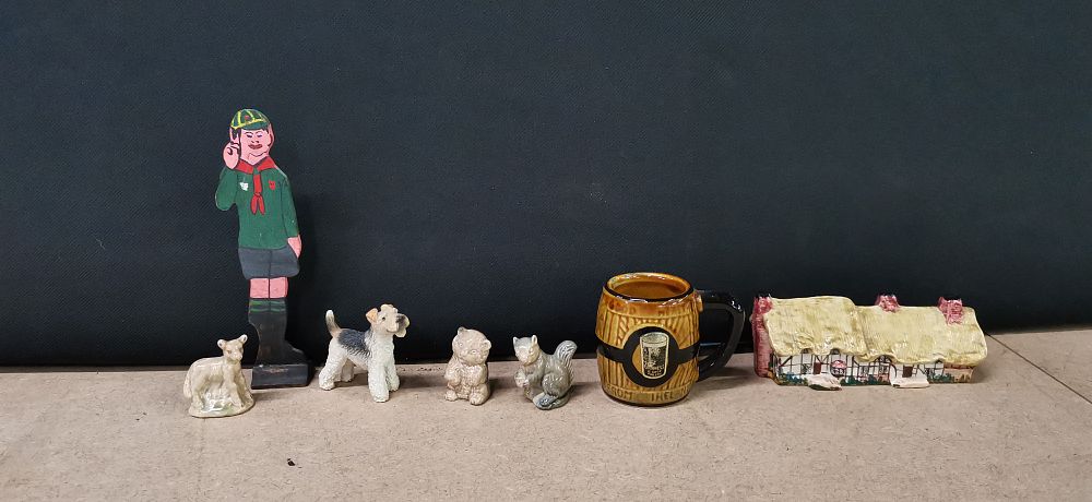 A Collection of Miniature Ceramic Figurines, a Guinness Advertising Mug, and a Boy Scout Figure