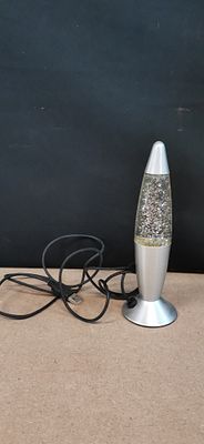 A Silver-Toned Rocket Style USB Powered Colour Changing Glitter Motion Lamp. Tested for Power