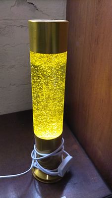 A Contemporary Gold-Toned Glitter Motion Table Lamp. Tested for Power