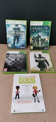 A Collection of Xbox 360 Video Games and a Factory Sealed Microsoft Points Card
