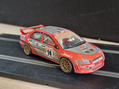 SCX 1/32 Scale Mitsubishi Lancer Evolution VII Rally Slot Car
