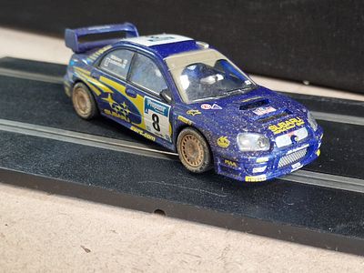 SCX TechniToys Subaru Impreza WRC No. 8 Slot Car with Dirt Effect