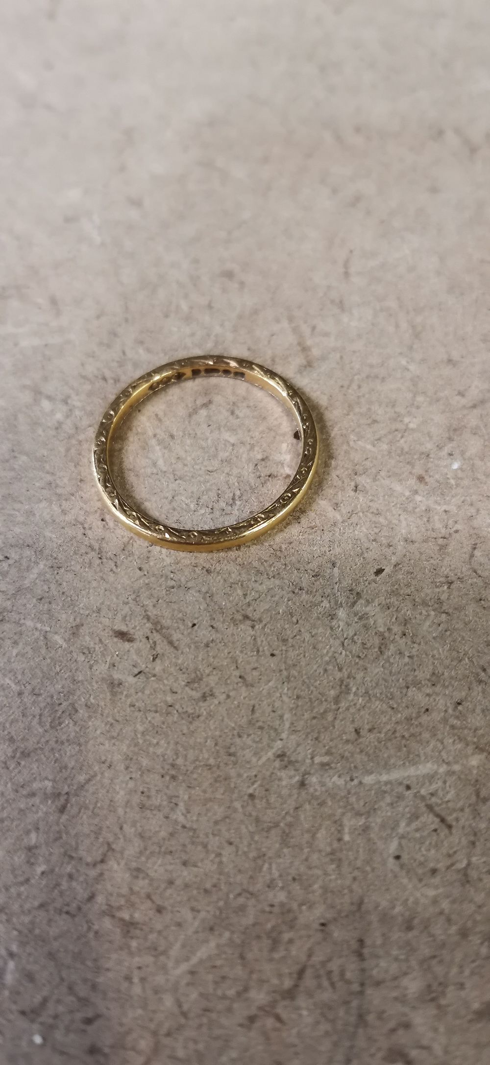 Lot 155: A 22ct Yellow Gold Engraved Band Ring by Shipton and Co