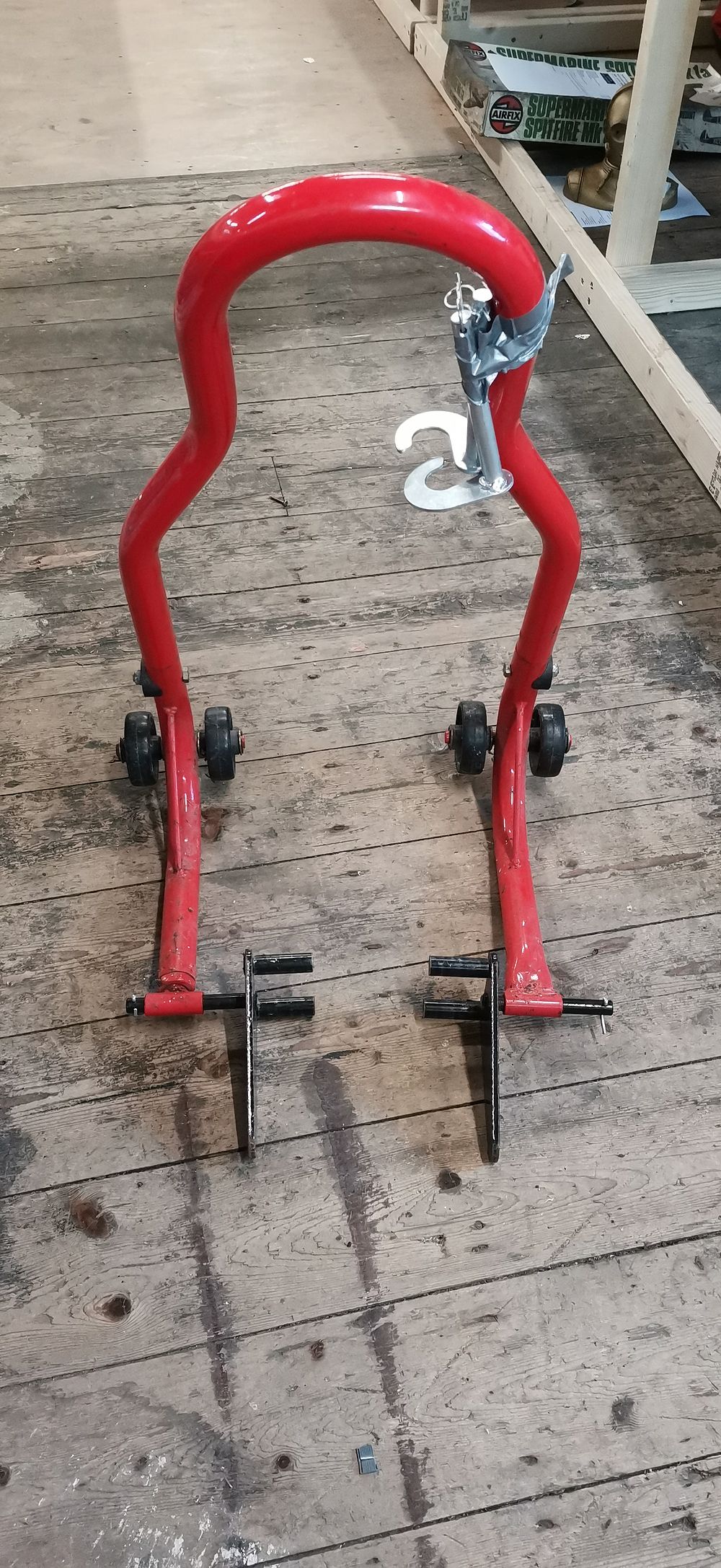 Lot 217: Universal Red Motorcycle Rear Paddock Stand with Two Pairs of Lifting Adapters