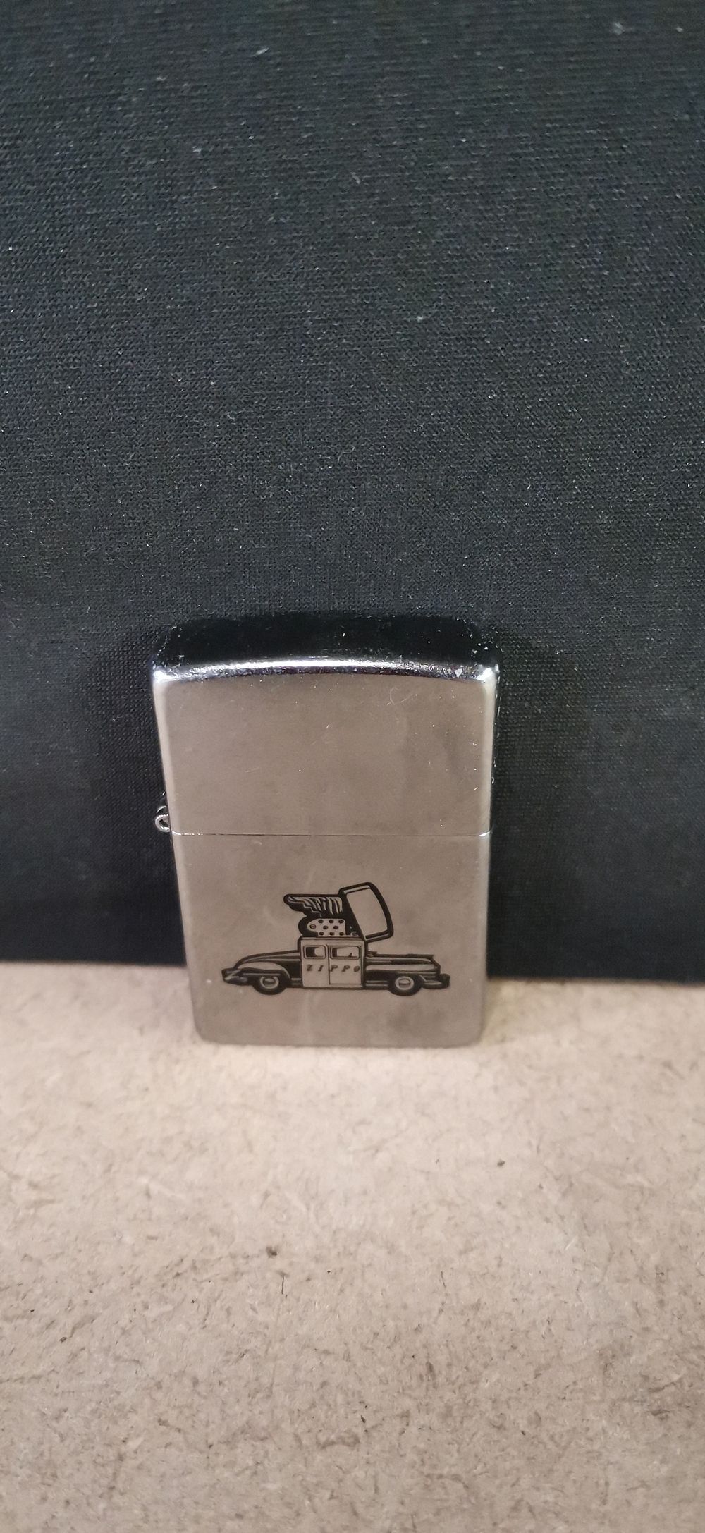 Lot 225: Zippo Brushed Chrome Windproof Lighter with Zippo Car Graphic, 2017