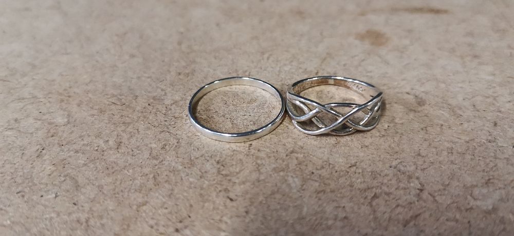 Lot 230: Two Sterling Silver Rings Including a Celtic Style Band