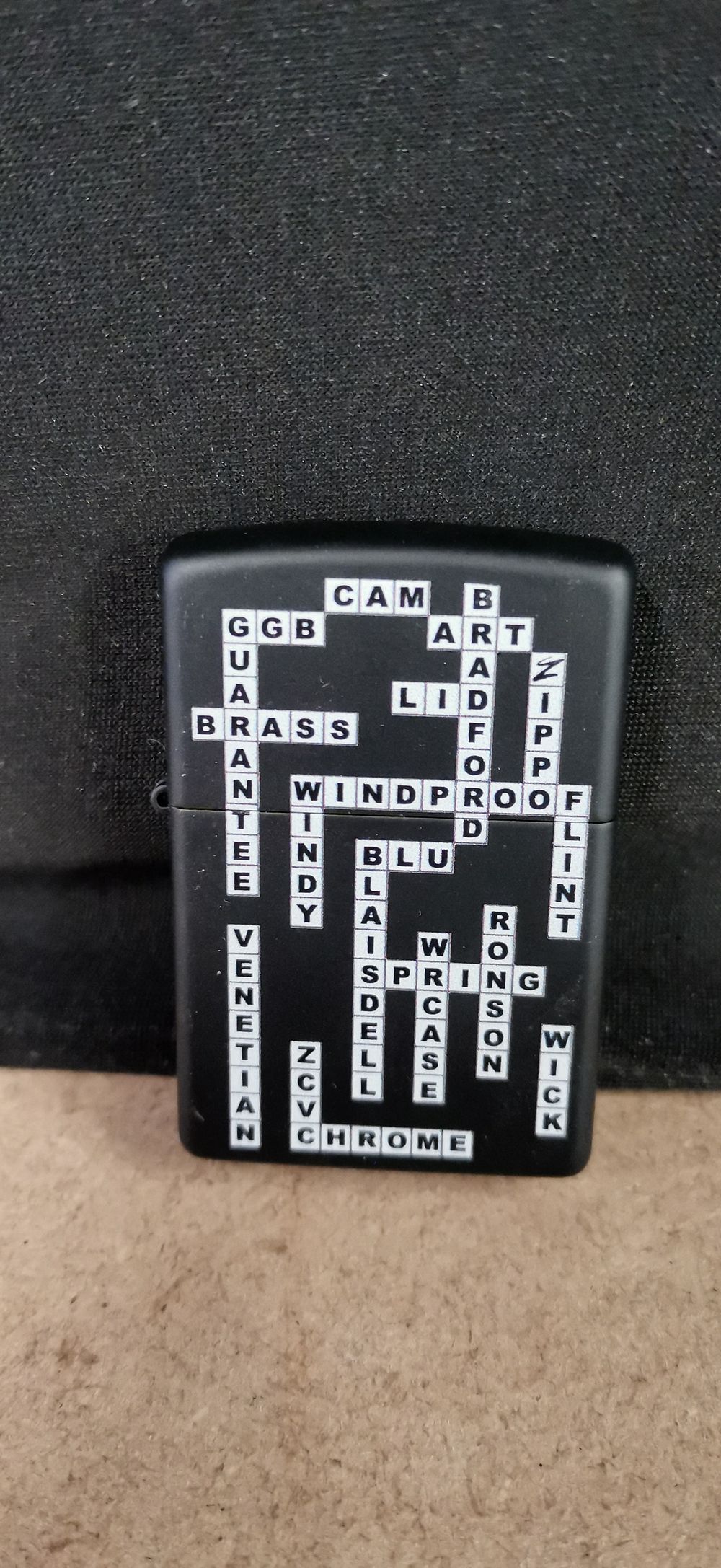 Lot 249: Zippo Crossword Puzzle Motif Windproof Lighter, 2018