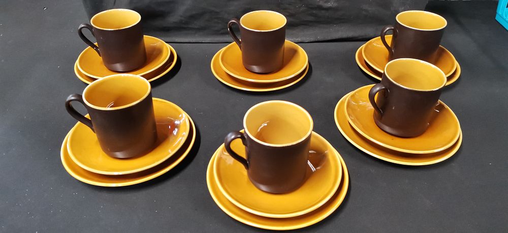 Lot 299: A set of six two-tone glazed ceramic coffee trios in the style of Myott Intone