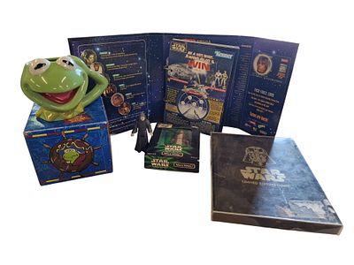 A Collection of Star Wars and Muppets Collectibles including Action Figures and Promotional Ephemera