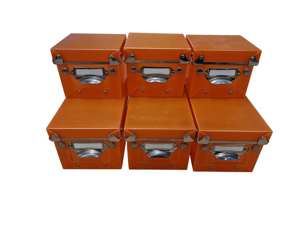 Lot 482: A Group of Orange Storage Boxes with Metal Fittings