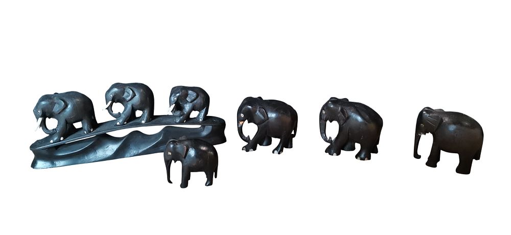 Lot 498: Seven Carved Ebony and Bone Inlaid Elephant Figurines