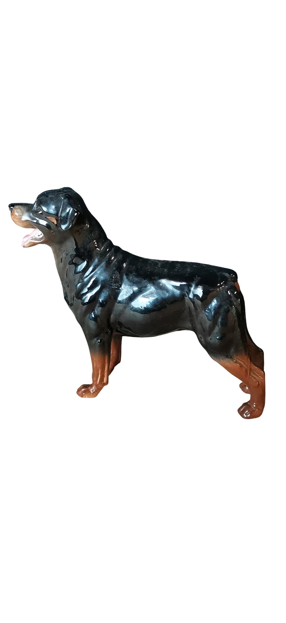 Lot 503: A glazed ceramic figurine of a Rottweiler dog.