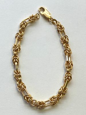 A 9ct yellow gold fancy linked bracelet, 7 1/4 inches long, hallmarked 9ct gold, 14 grams 