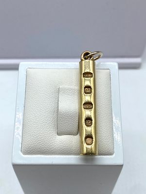 A 9ct yellow gold solid ingot tubular bar, 45mm x 6mm in size, 12.8 grams weight approx, hallmarked