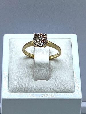 A 10ct yellow gold diamond cluster solitaire ring, 2.2 grams in weight approx, size N, diamond 