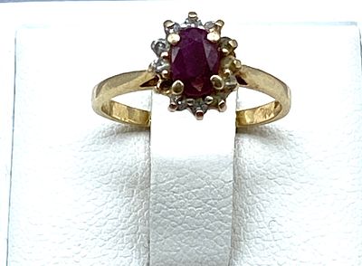 A 14ct yellow gold ruby & diamond dress ring. A 14ct gold ruby & diamond dress ring, size J 