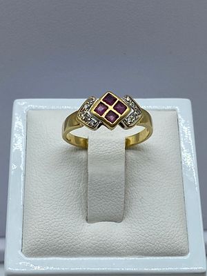 An 18ct yellow gold diamond & ruby dress ring, 2.8 grams in weight approx, size L