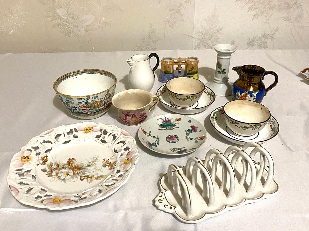 A mixed Victorian tea cups & toast rack