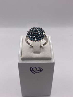 A 9ct white gold ring with enhanced blue / green diamonds, approx 3 grams in weight, ring size 