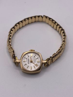 A 9ct yellow gold ladies watch case, strap is not gold, case weighs 2 grams approx,
