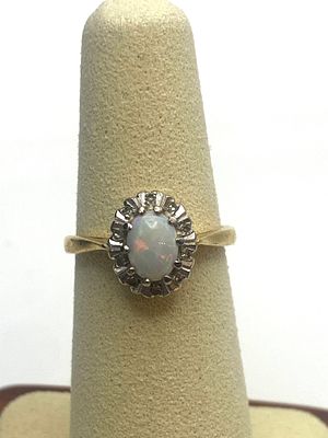 An 18ct yellow gold opal & diamond dress ring, approx weight is 3.5 grams, size J
