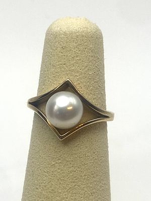 A 9ct yellow gold pearl dress ring, size G, pearl is 5mm - 6mm, 2.8 grams approx weight