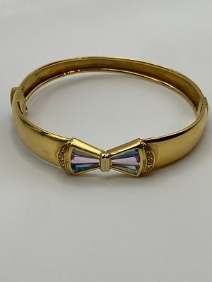 An 18ct yellow gold ladies dress bangle, hallmarked, set with semi precious stones, total 