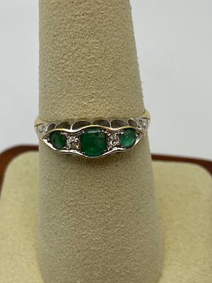 An 18ct yellow gold emerald & diamond dress ring, size O 1/2, 2.8 grams in weight approx, will 