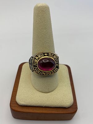 An 18ct yellow gold service awards ring, 25.4 grams in weight approx, size U