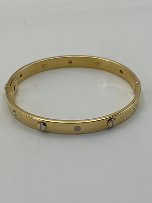 An 18ct yellow gold diamond bangle, weight 43 grams approx, bangle is solid gold,